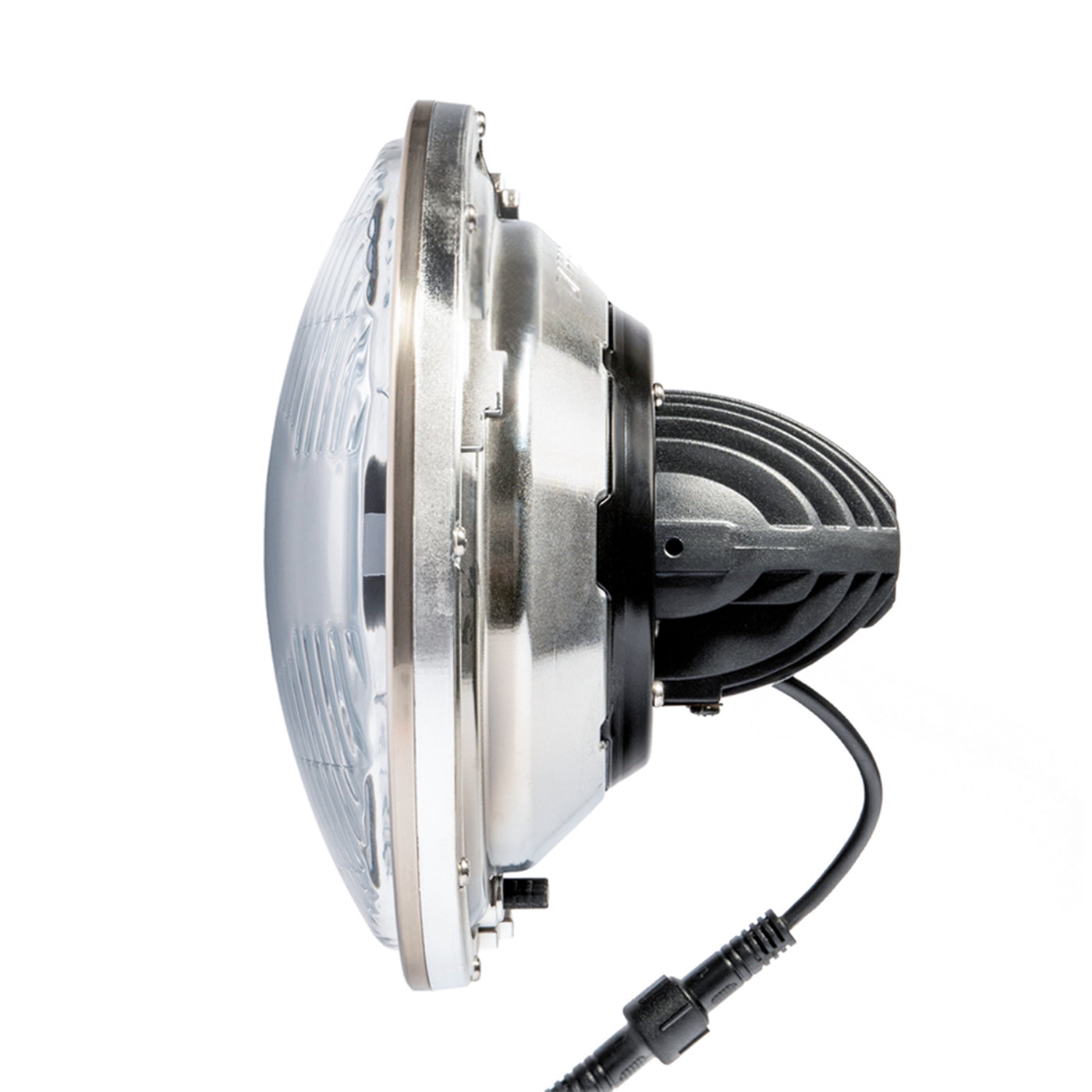 Side view of the LED Seven 2.0 showing its housing and narrow central cooling assembly behind the lens.